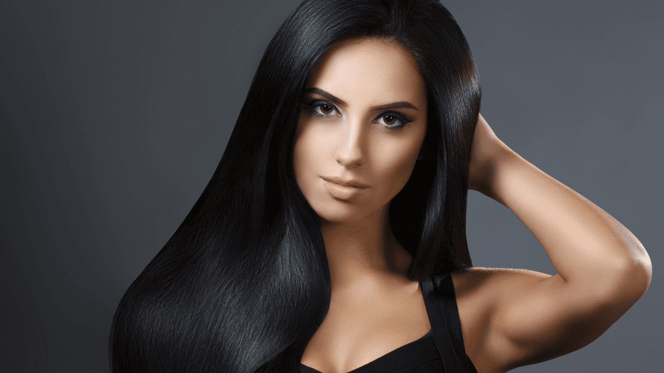 Woman with sleek, glossy dark hair at Simon Warwick Salons, Maida Vale – showcasing healthy, professionally coloured hair with expert aftercare results.