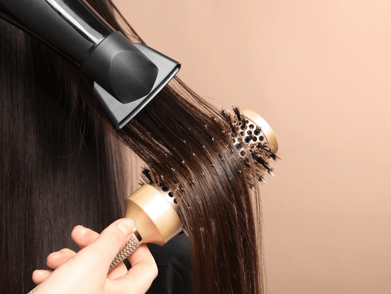 Expert blowdry in progress at Simon Warwick Salons, Maida Vale – round brush and dryer creating a smooth, polished finish for healthy, elegant hair.