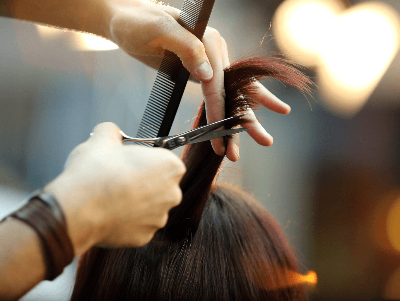 Professional haircut in progress at Simon Warwick Salons, Maida Vale – precise scissor work during a Ladies’ Shampoo, Cut & Blowdry service.