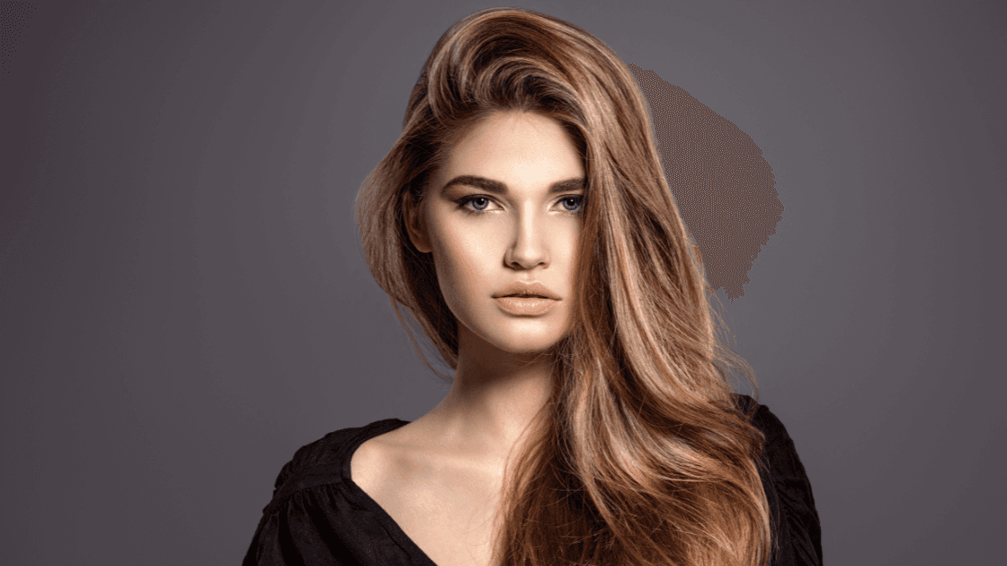 Model with long, voluminous highlighted hair at Simon Warwick Salons, Maida Vale – showcasing the natural finish of expertly applied Great Lengths extensions.
